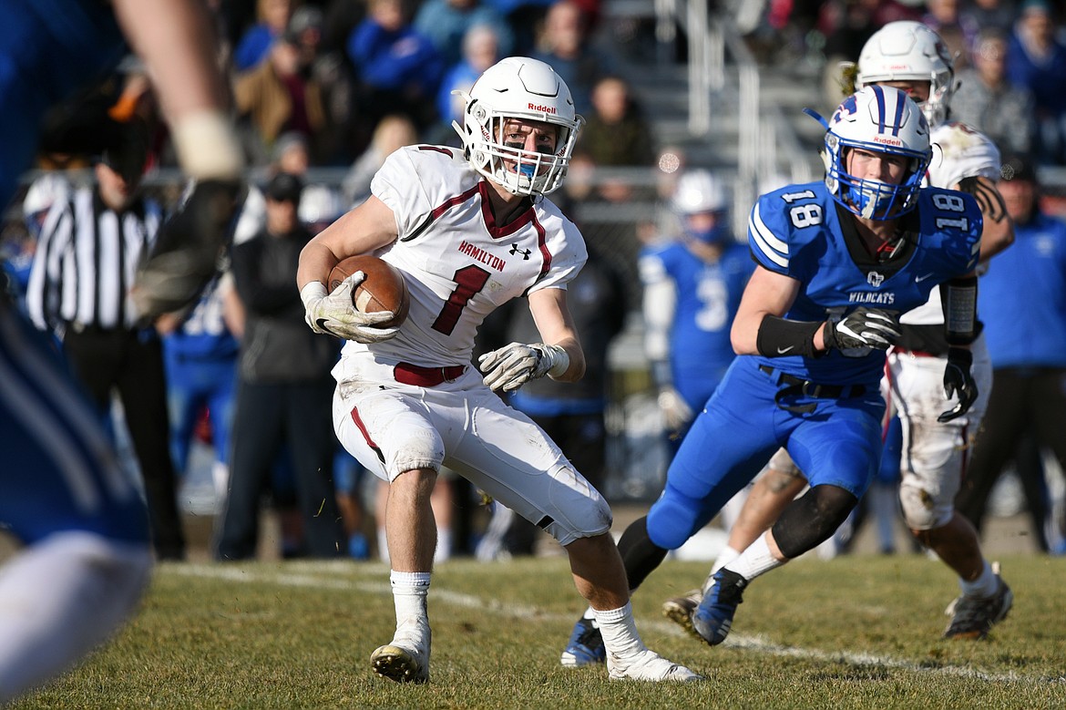 Hamilton wide receiver Camron Rothie (1) looks for room to run after a third-quarter reception against Columbia Falls in a Class A semifinal playoff game at Columbia Falls High School on Saturday. (Casey Kreider/Daily Inter Lake)