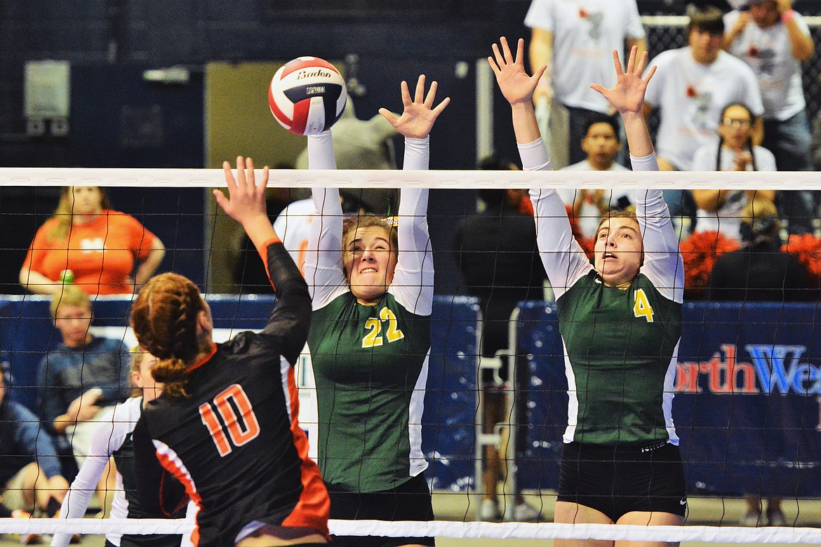 Payton Reisinger and Lucy Ridgeway rise up for the block against Hardin in the Class A State Tournament last week in Bozeman.