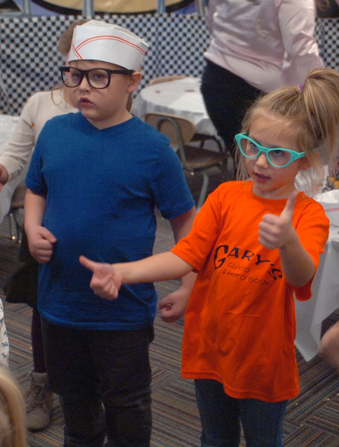 Jorgan Noble, left, and Kendall Spurr dance to Hand Jive during the 50s diner day last Friday in Katie Hillerman's kindergarten classroom at Plains School.