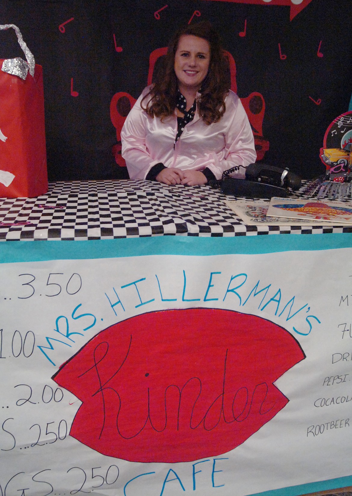 Plains kindergarten teacher Katie Hillerman used Classroom Transformations to turn her room into a 1950s diner last Friday. Above, she is ready to take orders for food and beverages.