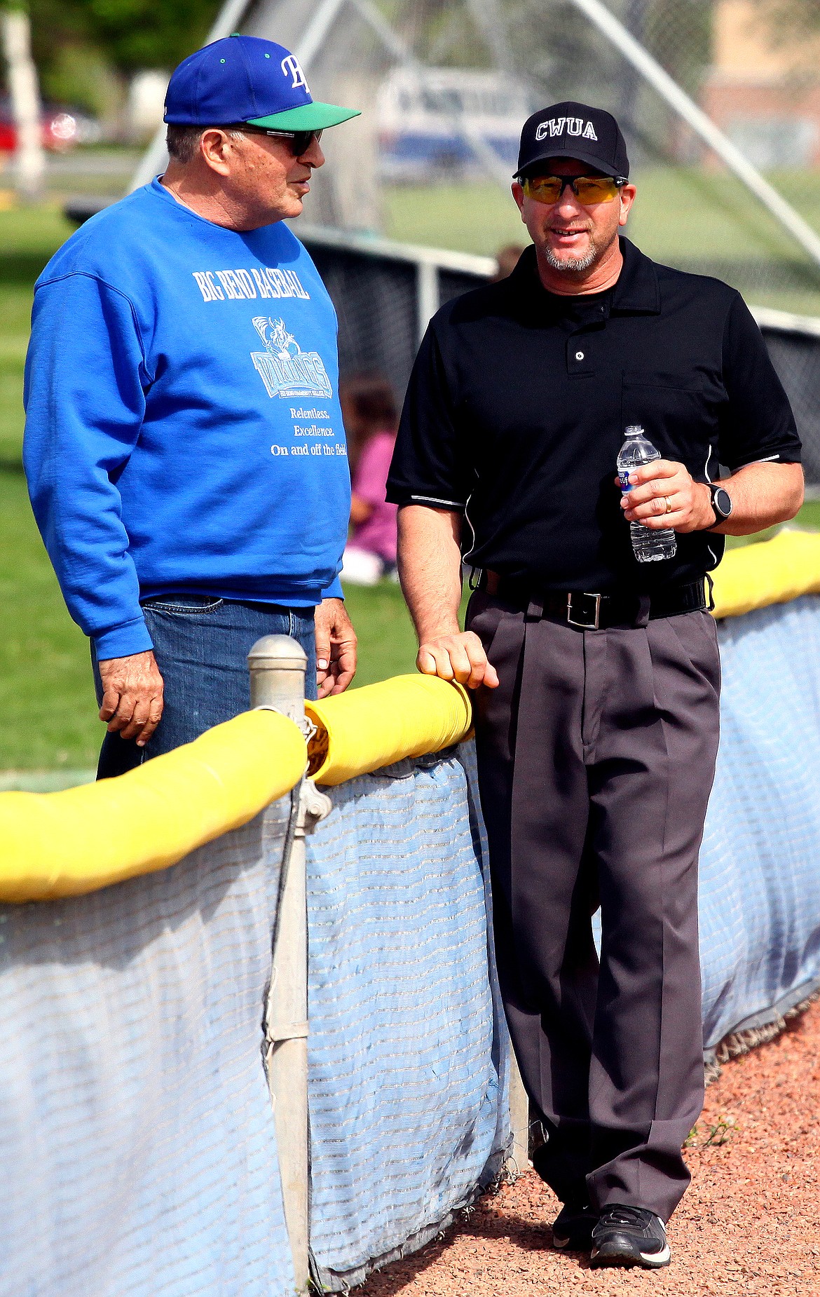 Rodney Harwood/Columbia Basin HeraldFormer Big Bend Community College baseball coach Pete Doumit talks with an umpire between innings the last time he visited Viking Field after his retirement.