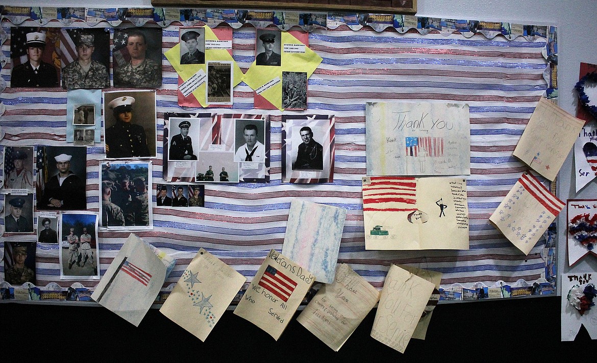 A wall in the St. Regis cafeteria was decorated with photos of local veterans and cards made by students thanking them for their service. It was part of a Veterans Day celebration held at the school on Nov. 8.