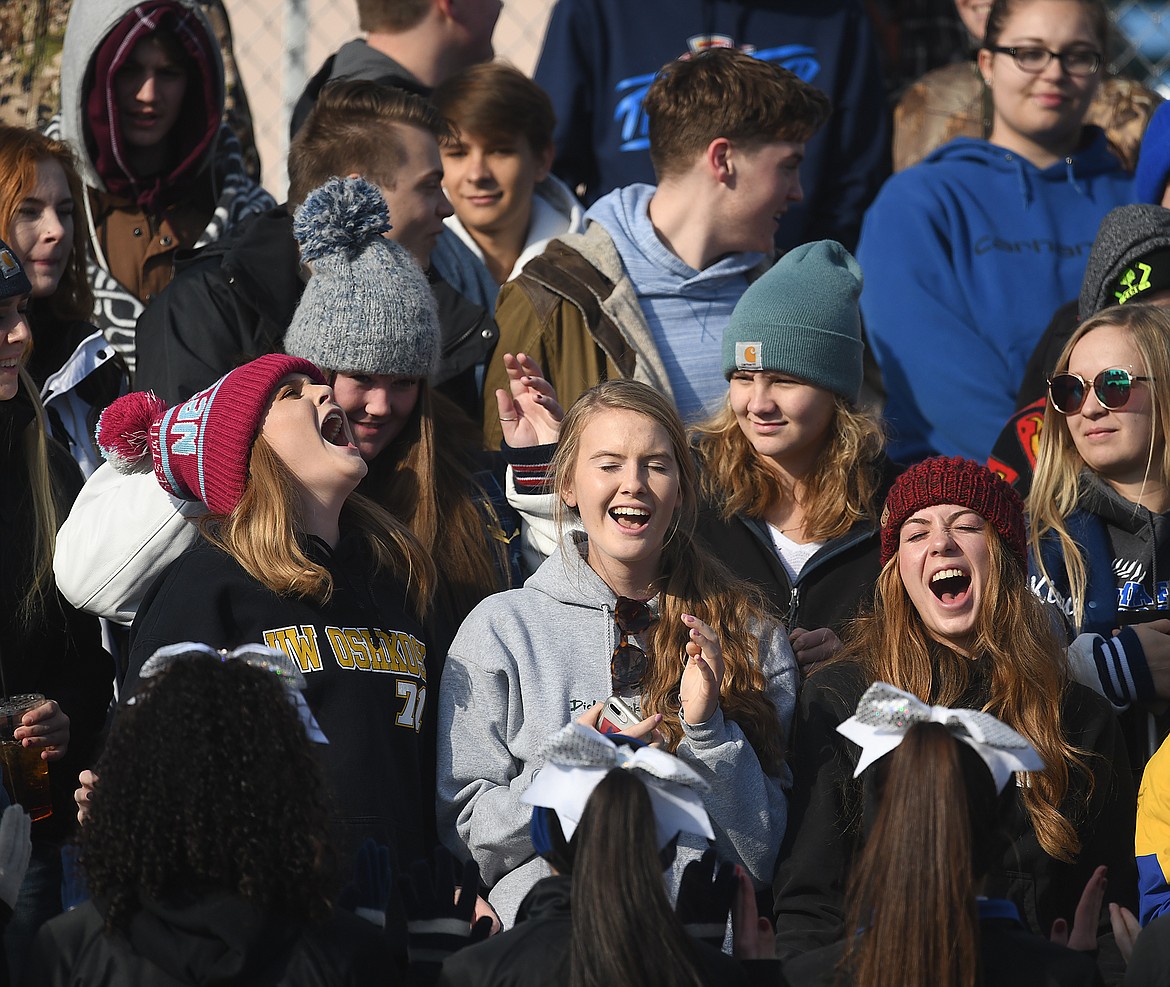 The student section cheers on the Cats.