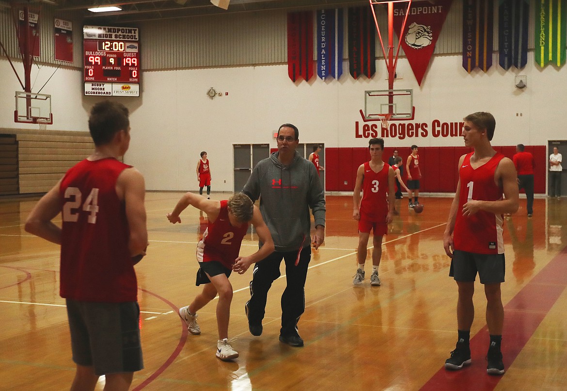 First-year head coach Wade Engelson directs players through a zone offense during a Nov. 27 practice.