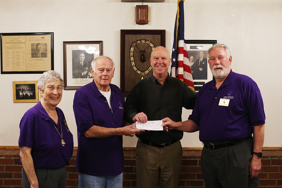 The Elks Club presents Press Christmas for All with a$5,000 donation. From left, Elks Secretary Mary Lou Riley, Chairman of the Trustees Dick Gardner, Coeur d&#146;Alene Press Managing Editor Mike Patrick, and Elks Exalted Ruler Jerry Lone. (LOREN BENOIT/Press)