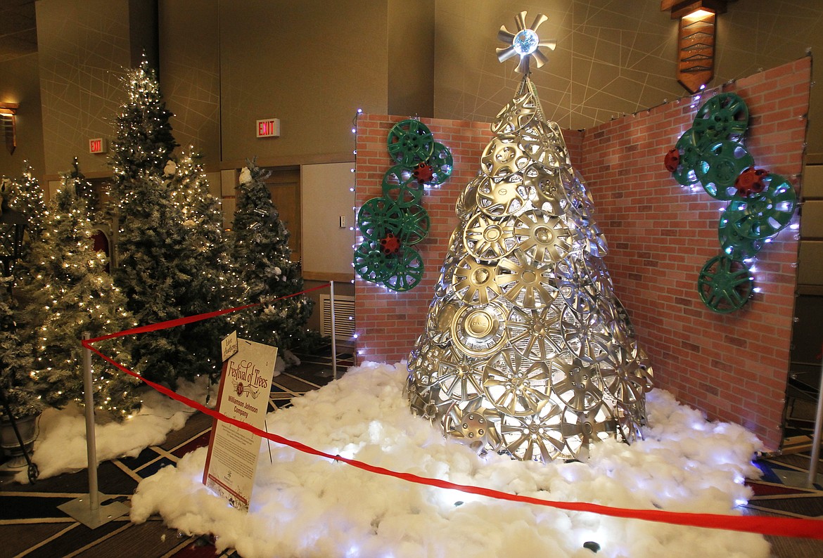 This hubcap tree, titled &quot;Cruising Through the Holidays,&quot; was one of nearly 30 trees up for auction Saturday during the 30th annual Kootenai Health Foundation Festival of Trees Brunch. The Festival, which annually begins on Friday and ends Monday, has raised more than $6.7 million to support different hospital projects since inception. (DEVIN WEEKS/Press)