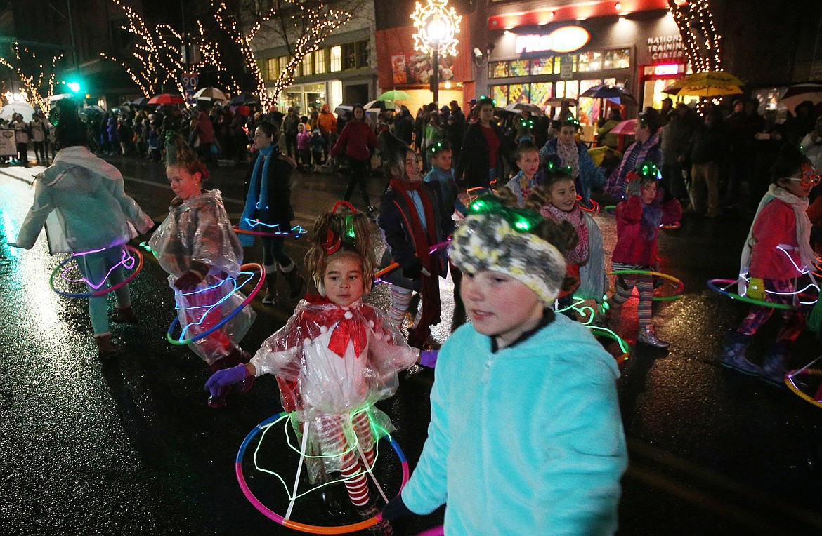 Kids in the Alta Dance Academy perform a dance as they make their way down the Holiday Parade route. (LOREN BENOIT/Press