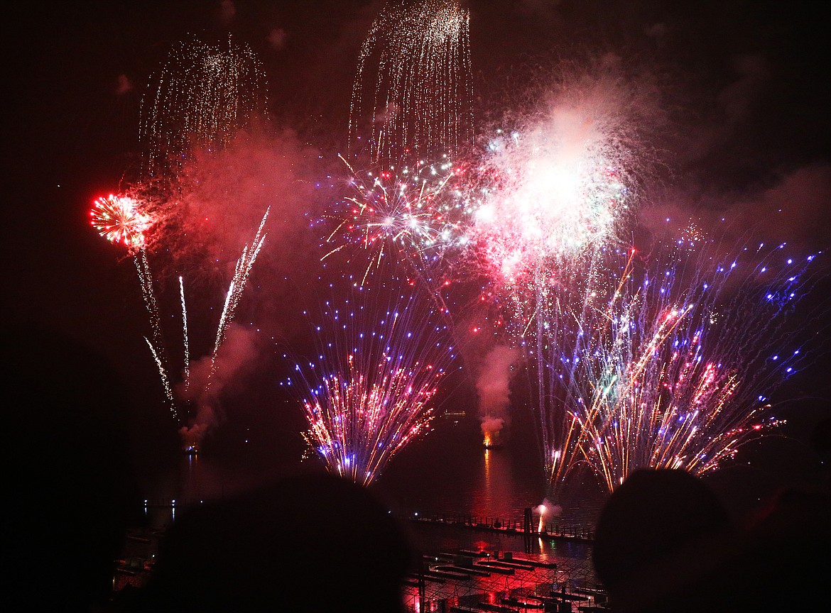 Photos by LOREN BENOIT/Press
Spectators watch fireworks erupt in the sky above Lake Coeur d&#146;Alene during The Coeur d&#146;Alene Resort Holiday Light Show fireworks display on Friday.