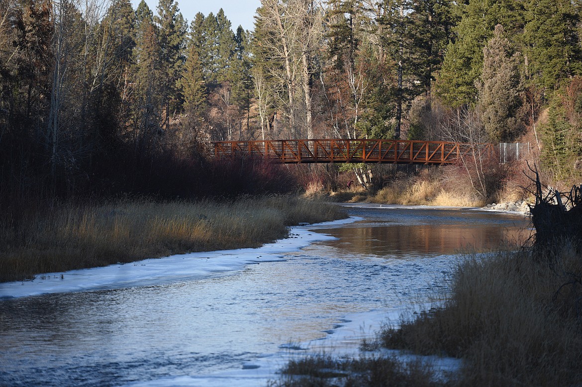 The Stillwater River flows through Lawrence Park in Kalispell and under a popular walking bridge on Tuesday, Nov. 20. (Casey Kreider/Daily Inter Lake)