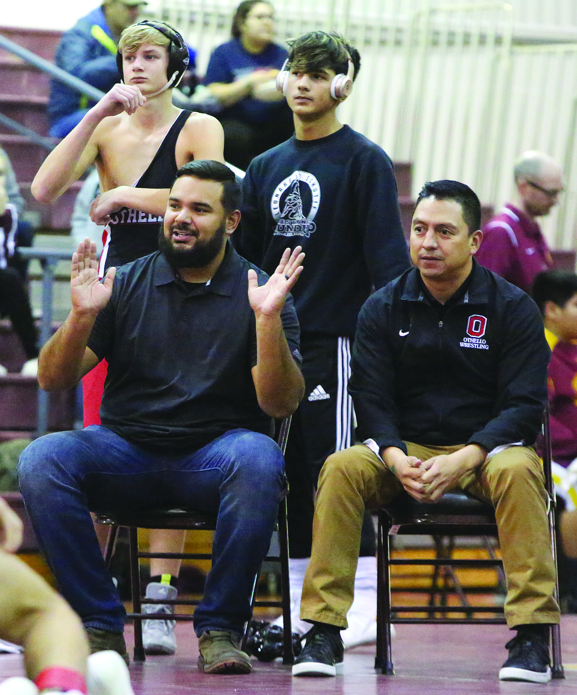 Connor Vanderweyst/Columbia Basin Herald
Othello head coach Rudy Ochoa II (seated left) reacts during a match at the Moses Lake Jamboree.