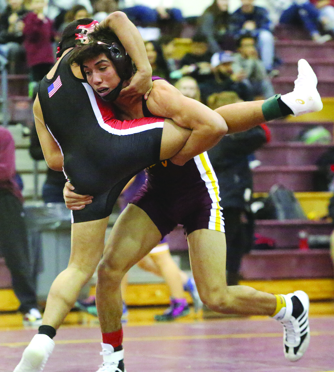 Connor Vanderweyst/Columbia Basin Herald
Moses Lake's Jonathan Tanguma goes for a takedown.