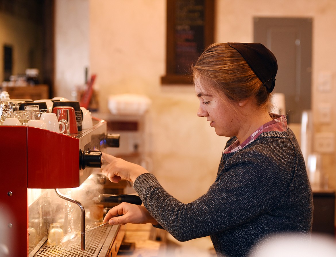 Holly Koehn makes a latte at the Dobson Creek Coffee Company on Tuesday, November 13, in Ronan.(Brenda Ahearn/Daily Inter Lake)