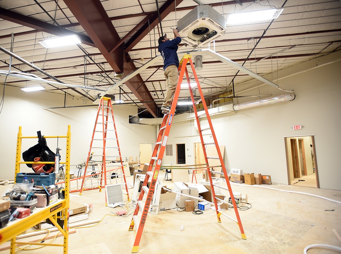 Hank McLeod of Mission Heating and Air working at the new home of the Boys and Girls Club of Flathead Reservation and Lake County on Tuesday, November 13, in Ronan.(Brenda Ahearn/Daily Inter Lake)