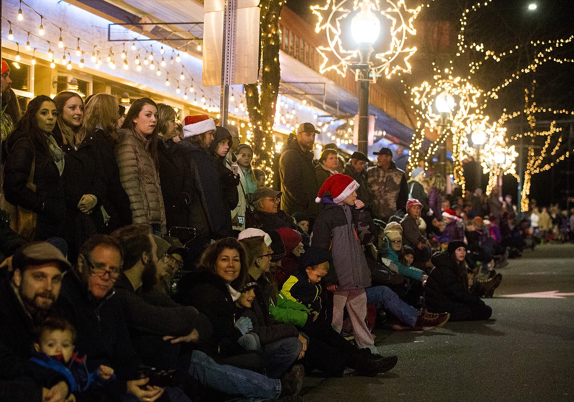 Hundreds gather to watch Santa, high school bands and more parade down Sherman Avenue during last year's Lighting Ceremony Parade. The 2018 parade and Coeur d'Alene Resort Holiday Light Show are ramping up to be the biggest yet, with more parade entries and more fireworks than ever before. (LOREN BENOIT/Press File)