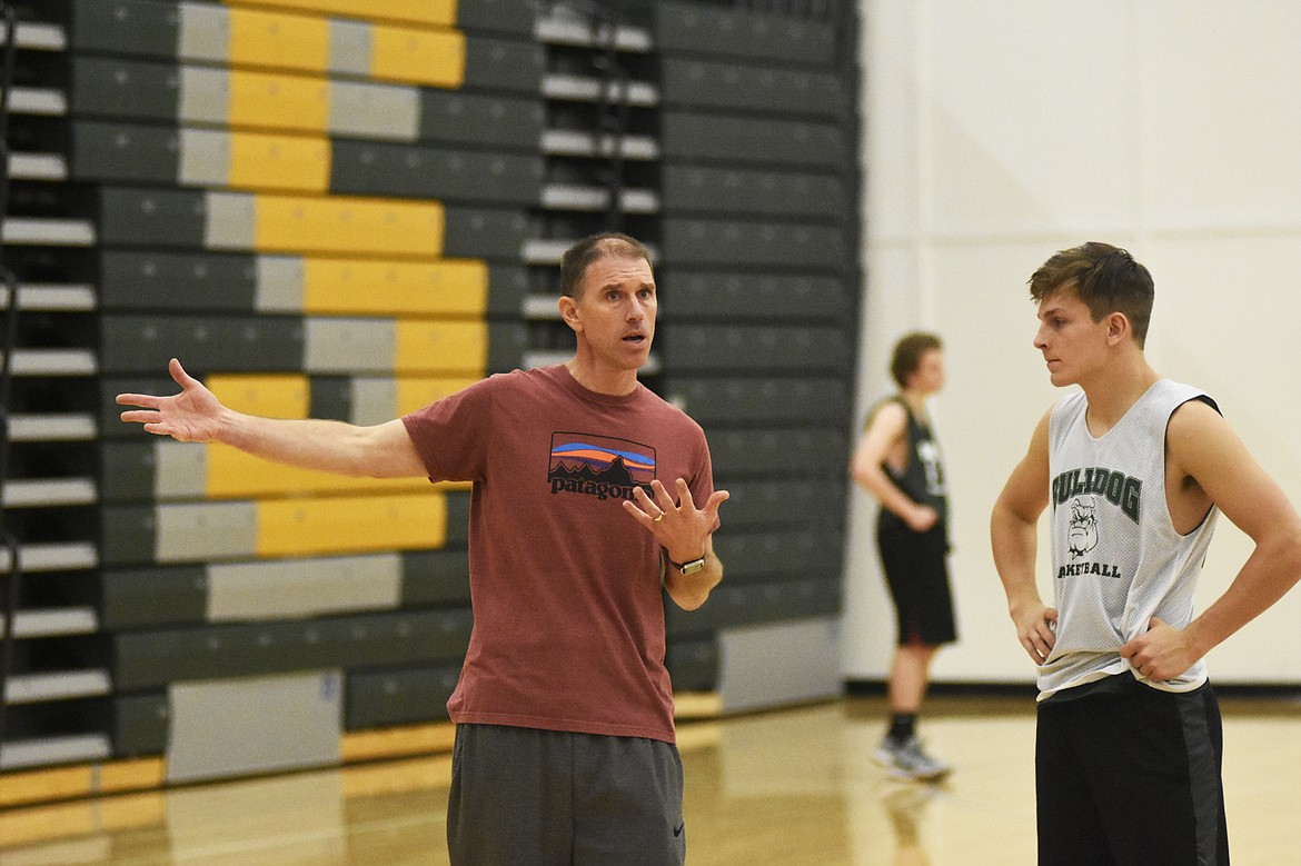 Bulldogs head coach Scott Smith works through a new offensive during a practice Monday afternoon. (Daniel McKay/Whitefish Pilot)