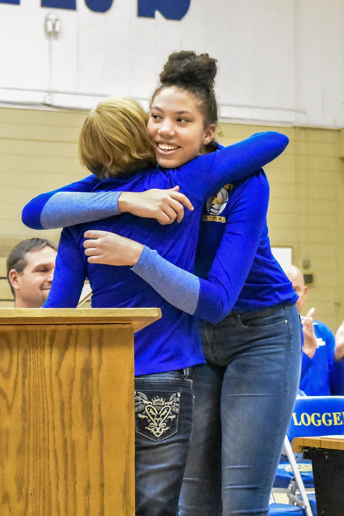 Libby High School volleyball Head Coach Cindy Ostrem-Johnston hugs senior Mehki Sykes, All State and First Team All Conference, during the Fall Awards Assembly Thursday. Ostrem-Johnston said that Sykes &#147;hits the ball so hard she clears the student section out!&#148; (Ben Kibbey/The Western News