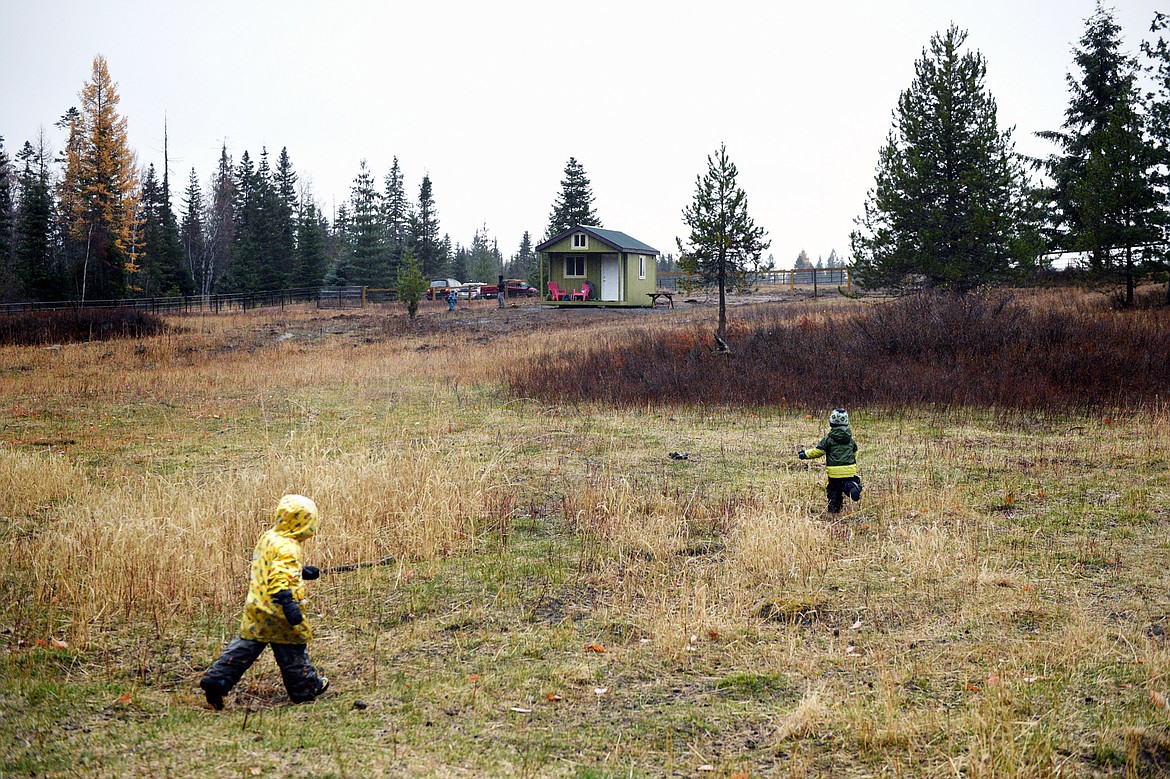 Students head back to the schoolhouse after a hike at Foxtail Forskola at Earthstar Farms in Whitefish on Wednesday, Oct. 31. Foxtail Forskola is a Scandinavian-inspired forest school where nature is othe classroom. Children ages 3-6 spend nearly all of the school day outdoors learning social and emotional readiness through free play and nature-based activities on a 35-acre organic farm. (Casey Kreider/Daily Inter Lake)