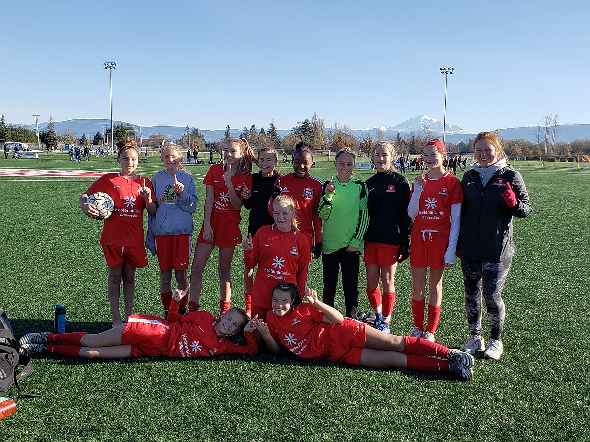 Courtesy photo
On Saturday the Thorns North FC &#146;06 Girls Red soccer team team tied Eastside FC G06 Blue Team 1-1. Lucy Simpson scored for the Thorns, assisted by Jillian-Kate Scott. On Sunday the Thorns beat Whatcom FC Rangers Girls 06 Blue 4-0 to move them into first place in the RCL League. Izabella Douglas scored two goals, and Elliana Rietze and Naomi Kessler scored once each. In the front row from left are Taylor Miller and Izabella Douglas; middle row Emersen Duncan; and standing from left, Jillian-Kate Scott, Lucy Simpson, Emily Medina, Elliana Rietze, Naomi Kessler, Acaja-Lyn Scott, Violet Andrews, Paisley Goings and coach Kandace Leliefeld. Not pictured are Madeline Daigle, Sally Gatten, Macie Lilyquist, Devyn Pirwitz and Kaylie Smart.