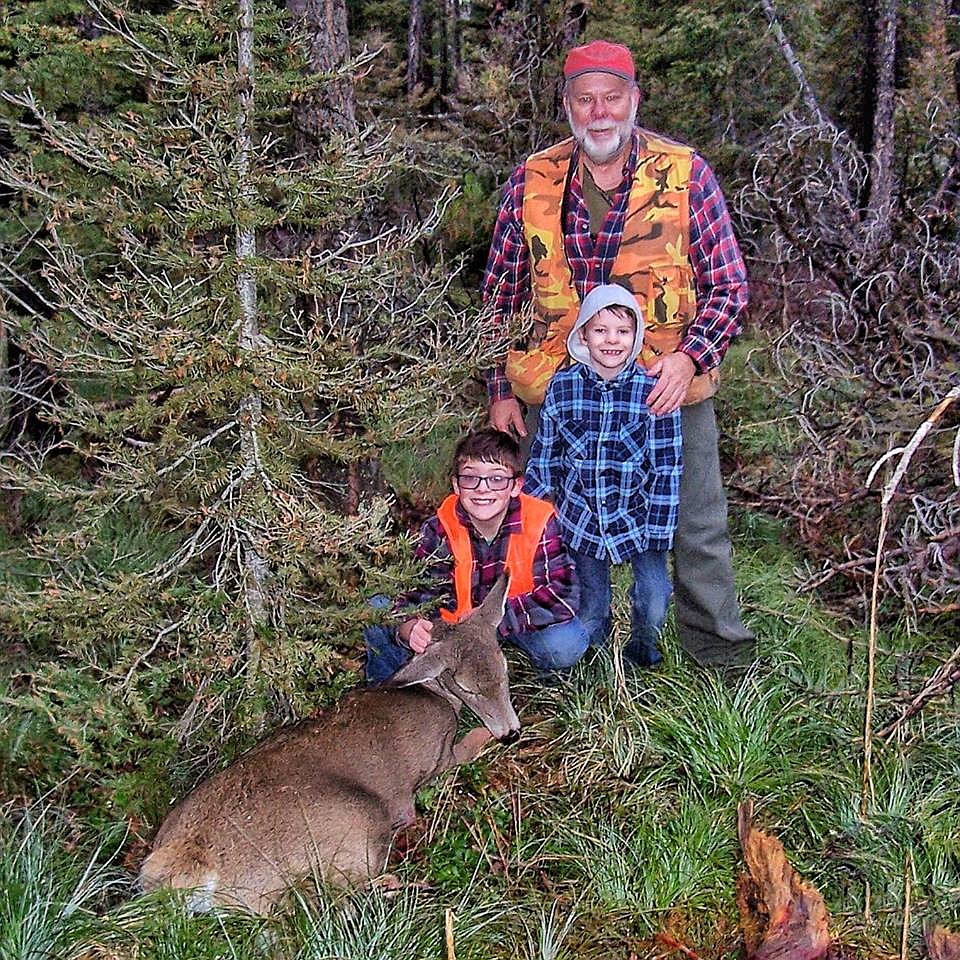 Sam Doughty (10) from Alberton poses with his first doe shot near Garnett. Behind him is his younger brother, Wyatt, and grandpa, Richard Doughty. (Photo courtesy of Matt Doughty).