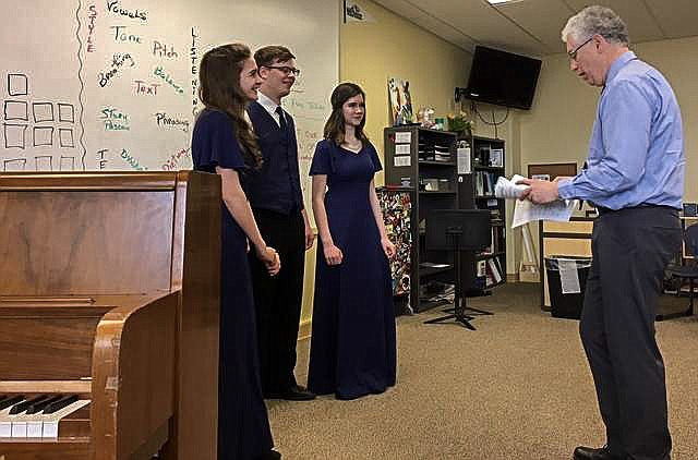 Sophie Lee at the District Music Festival at Glacier High School last spring. Pictured are Mikalyn Zeiler, Kaleb Lindgren and adjudicator Larry Sheldon (Courtesy photo)