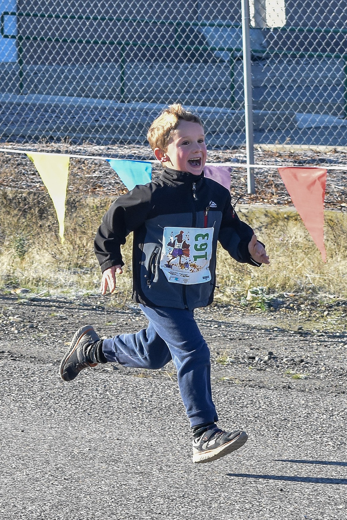 Corban Sloan sprinted out the final stretch with a smile on his face during the Turkey Dash 5k fun run/walk Saturday, Nov 17. (Ben Kibbey/The Western News)