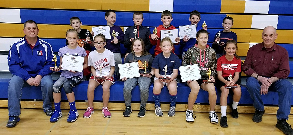 THE CLARK Fork Valley Elks Hoop Shoot was held Nov. 11 in the Thompson Falls High School gym. First- and- second-place finishers received trophies, and the division winners qualified for the district competition Jan. 12 in Pablo. Pictured, front row from left, Hoop Shoot coordinator Mike Thilmony, Gabi Hannum, 1st, 10-11 girls; Callie Cano, 2nd, 10-11 girls; Hailey Lowe, 1st, 8-9 girls; Ava Lawyer, 2nd, 8-9 girls; Avery Burgess, 1st, 12-13 girls; Olivia Fitchett, 2nd, 12-13 girls; and Hoop Shoot volunteer and Elks Lodge member Don Manning; back row, Cooper Meredith, 2nd, 8-9 boys; Jay Beahan, 1st, 8-9 boys; Aiden Currie, 2nd, 12-13 boys; Carson Toivenon, 1st, 10-11 boys; Conor Toivenon, 1st, 12-13 boys; and Braedon Ferris, 2nd, 10-11 boys. (Photo courtesy of Mike Thilmony)