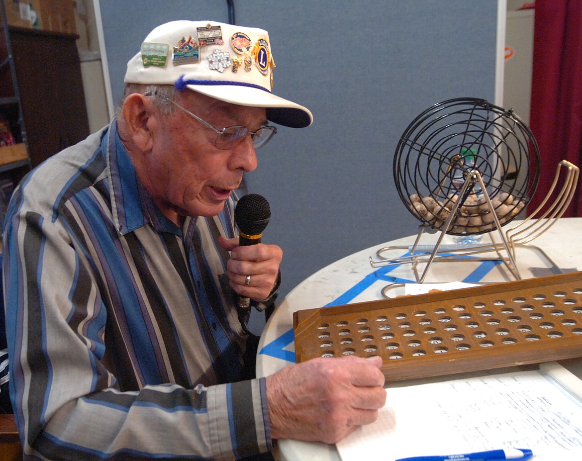 Jay Erchul calls a number during an OGNIB game Sunday night during the Hot Springs Lions Club fundraiser in the Hot Springs School multi-purpose room.