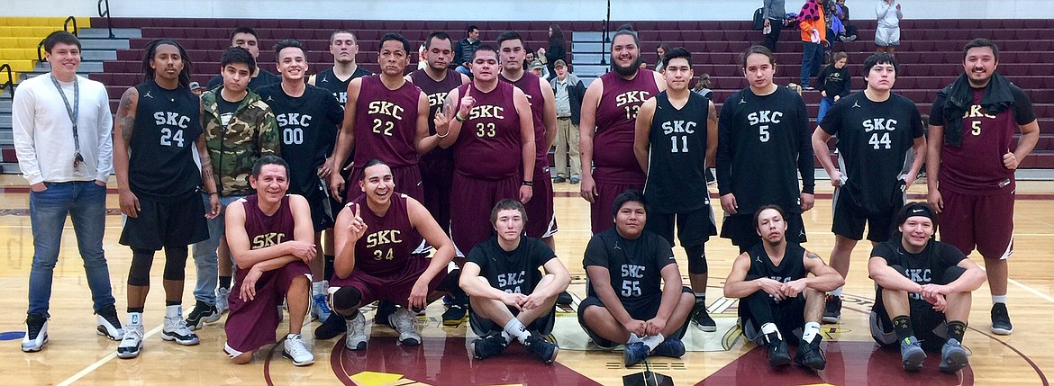 The 2018 SKC Bison men&#146;s basketball team (dark jerseys) pose with the Alumni&#160;(maroon jerseys) at the conclusion of their Founder&#146;s Week game.&#160;Both teams&#160;surpassed the century mark with the Alumni edging ahead 132-121.&#160;Back row, Alumni: Howard Walker, Cedric Earthboy, (13) Isaac Camel; middle row, Alumni:&#160;(22) JR Camel, (33) Camas McClure; far right, (5) Jalen Croft; kneeling,&#160;Alumni: farthest left, Carlin Matt, (34) DJ Fish. (Photo courtesy of Juan&#160;Perez)