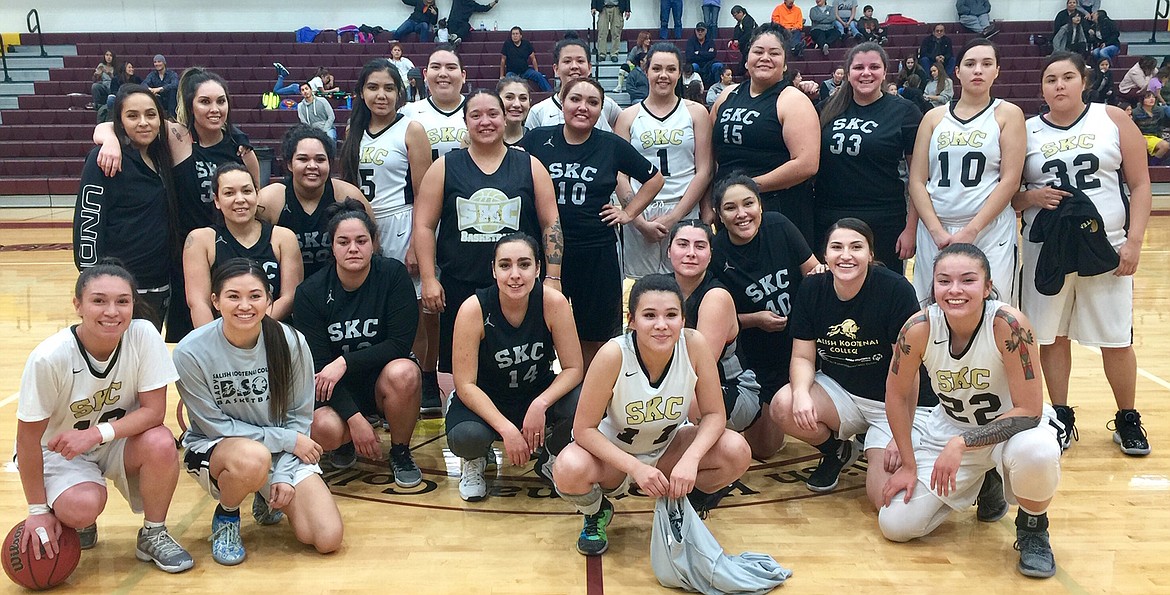 The 2018 SKC Lady Bison (white jerseys) pose with their Alumni predecessors&#160;(dark jerseys) at the conclusion of their Founder&#146;s Day Alumni contest won&#160;by the current crop of Lady Bison 67-37.&#160;Alumni (not in sequence): (1) Moriah Friedlander, (3) Katie McDonald (center with SKC logo), (10)&#160;Shanelle Skunkcap, (12) Eva Green, (14) Amy TallBull, (15) Carla Torossian,&#160;(20) Darryl Conko-Camel (23) Crystal Matt, (32) Misty Ostlie, (33) Cecelia&#160;Koskela and (40) Kaylea Skunkcap.&#160;See online roster for Lady Bison player&#160;jersey affiliations.&#160;(Photo courtesy of Juan Perez)