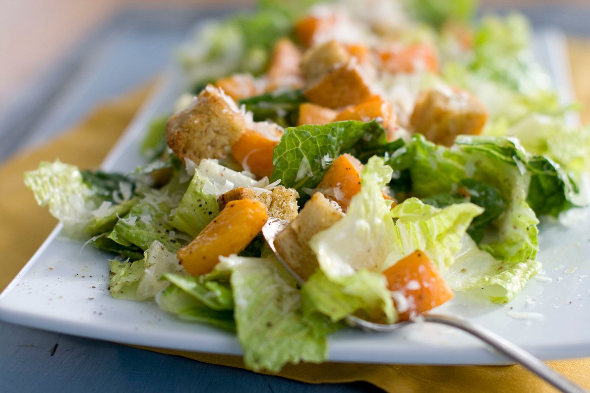 FILE - This Jan. 24, 2012, file photo shows a Caesar salad with romaine lettuce. Food regulators are urging Americans not to eat any romaine lettuce because of a new food poisoning outbreak. The FDA says it's investigating an E. coli outbreak that has sickened over two dozen people in several states. The FDA says it's working with officials in Canada, where officials are also warning against romaine lettuce. (AP Photo/Matthew Mead, File)