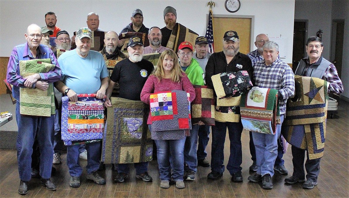 Eighteen local veterans received &#147;thank you&#148; quilts from the Cabin Fever Quilt Guild in St. Regis during a luncheon on Nov. 17. (Kathleen Woodford/Mineral Independent)