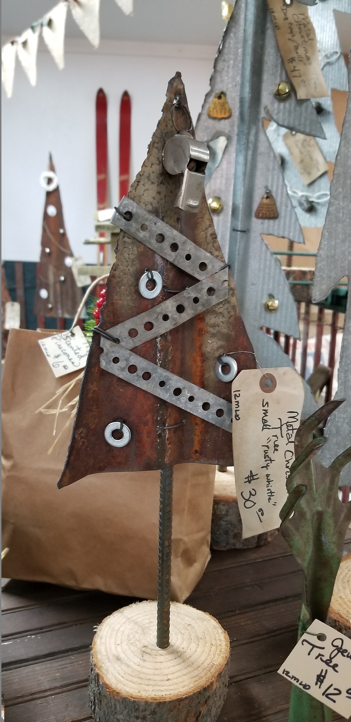 Metal items are very popular right now, such as these Tramp Art style Christmas trees.