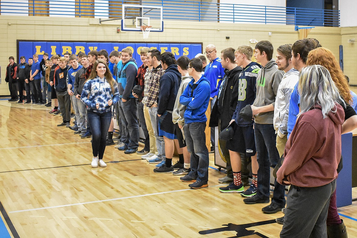With his student athletes assembled in front of him, Head Coach Neil Fuller talks about the accomplishments of the Libby High School football team during the Fall Awards Assembly Thursday. (Ben Kibbey/The Western News)