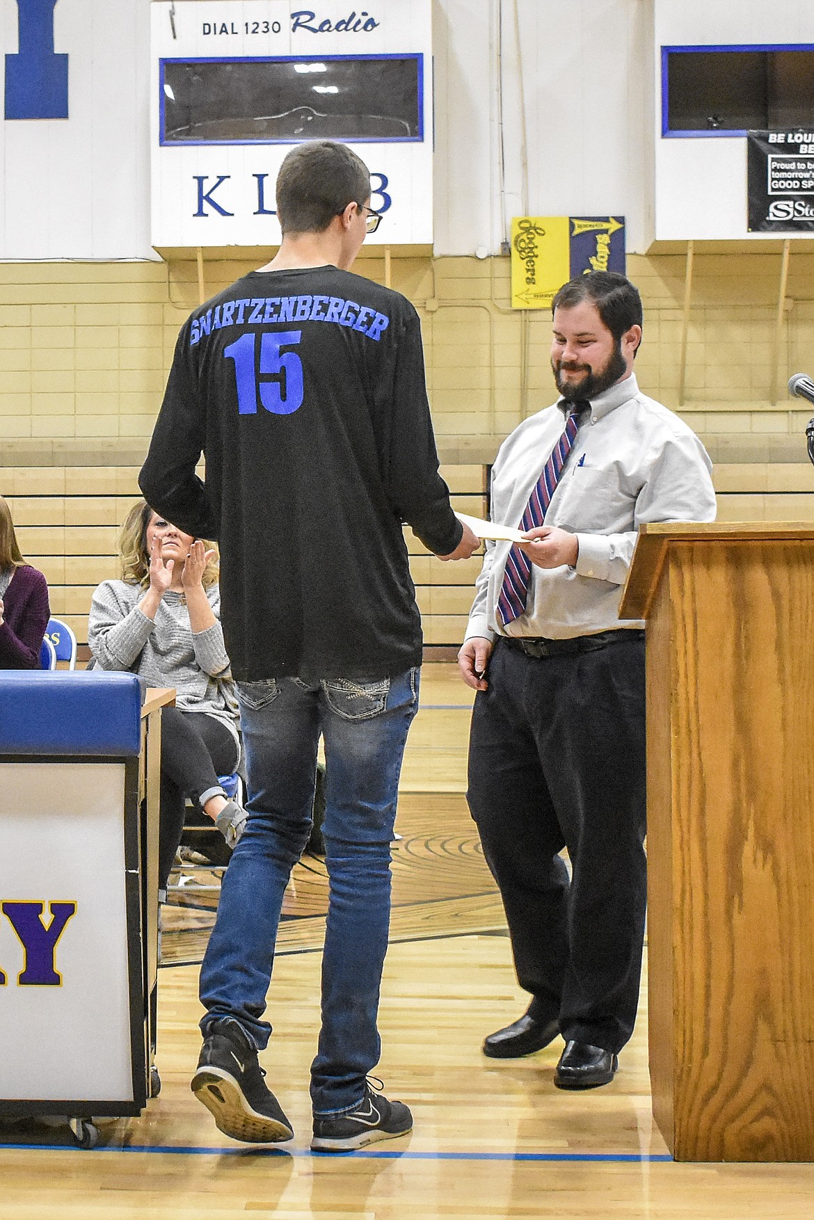 Libby High School boys soccer Head Coach Jeff Zwang presents the &#147;Most Valuable Player&#148; team award to senior Austin Swartzenberger -- who was also named to Second Team All Conference -- during the Fall Awards Assembly Thursday. (Ben Kibbey/The Western News)
