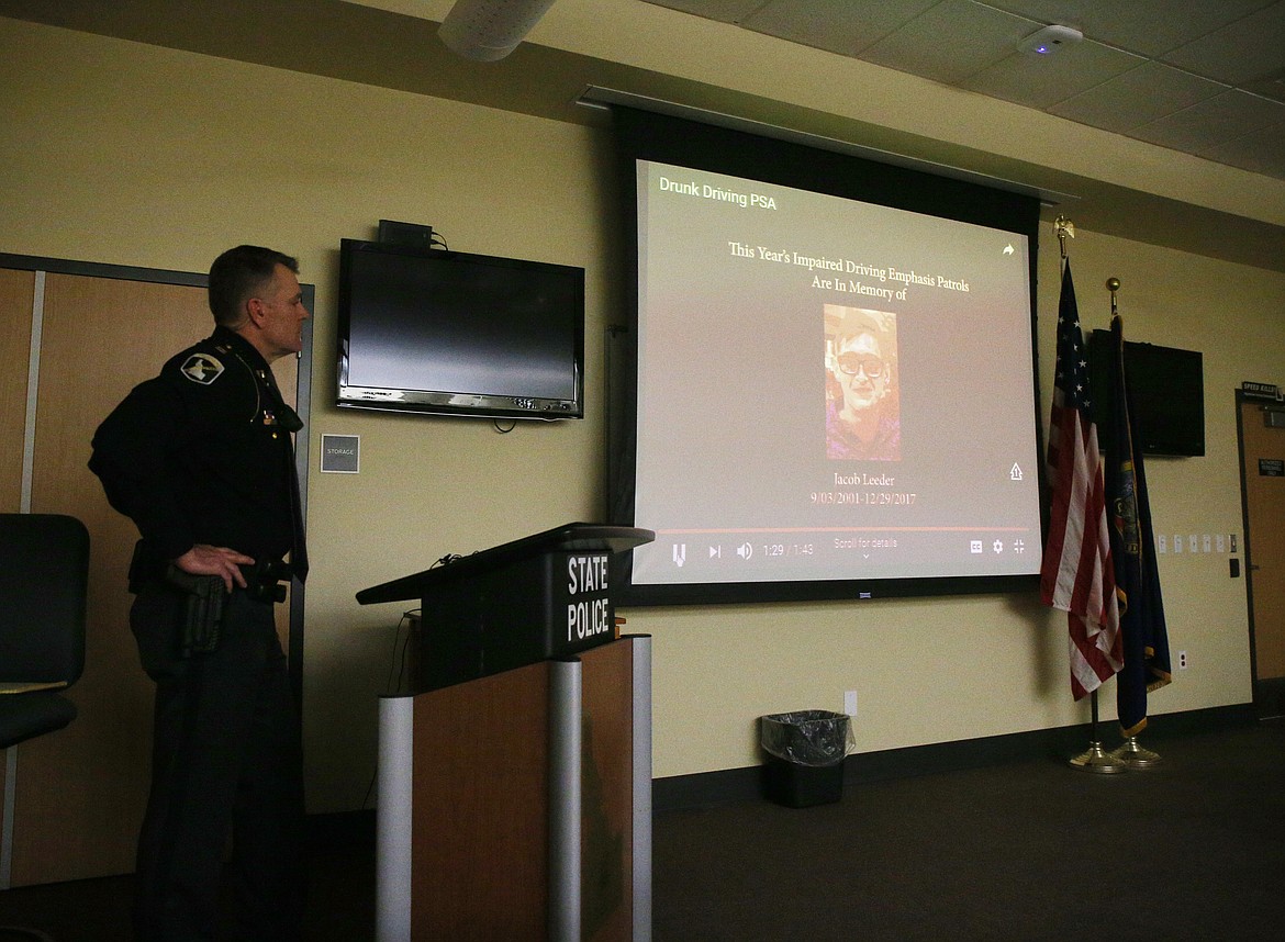 Capt. John Kempf with Idaho State Police shows a short public service announcement video featuring local law enforcement officers reminding drivers to choose wisely this holiday season. This year's PSA is in memory of Jacob Leeder, who was the son of Sgt. Tim Leeder with the Kootenai County Sheriff's Office. He died last December after the vehicle he was riding in was struck by a drunk driver. (LOREN BENOIT/Press)