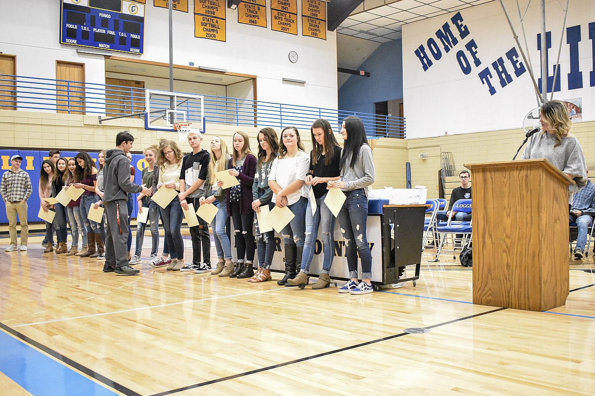 Cheer Coach Jennifer McElmurry announces the awards for the Libby High School cheer squad during the Fall Awards Assembly Thursday. (Ben Kibbey/The Western News)