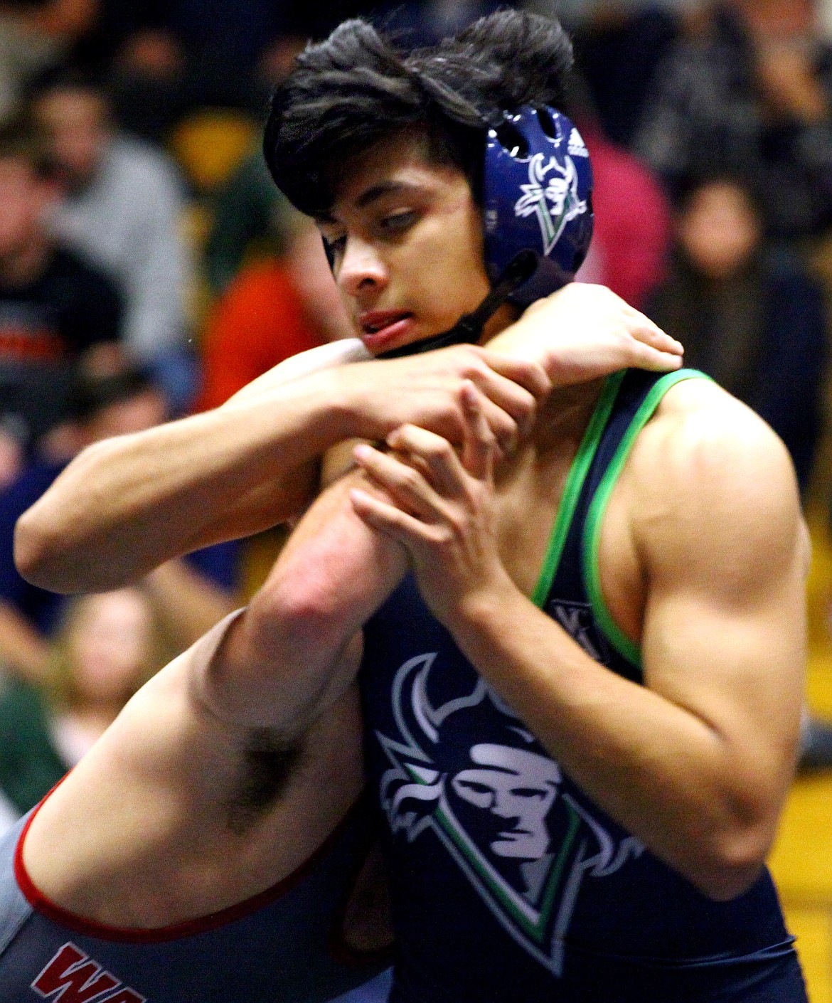 Rodney Harwood/Columbia Basin Herald
Big Bend's Eduardo Rodriguez of Royal City works his way out of the grasp of Washington State's Joseph Lewis during the 133-pound match on Thursday at DeVries Activity Center.