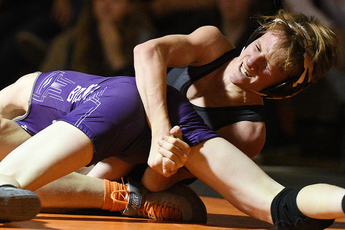 Flathead's Cole Eastwood battles in the closing seconds against Butte's Keagan Gransbery at 103 pounds at Flathead High School on Friday. (Casey Kreider/Daily Inter Lake)