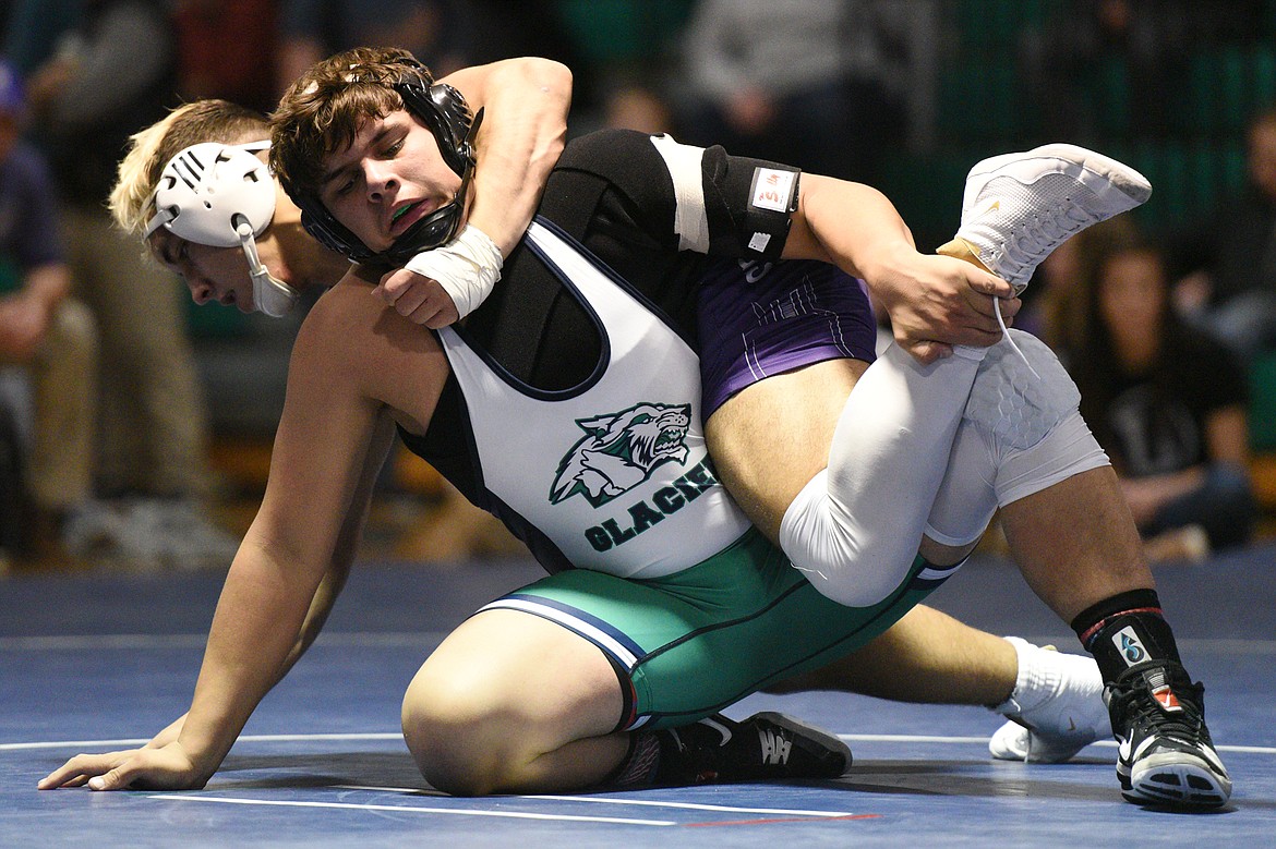 Glacier's Colby Martin wrestles Butte's Kameron Moreno at 205 pounds at Glacier High School on Friday. (Casey Kreider/Daily Inter Lake)