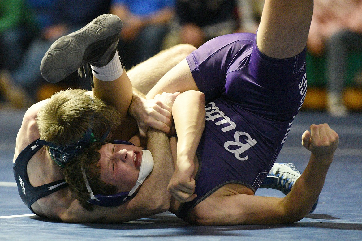 Glacier's Tristan Little works toward a pin of Butte's Connor Konda at 126 pounds at Glacier High School on Friday. (Casey Kreider/Daily Inter Lake)