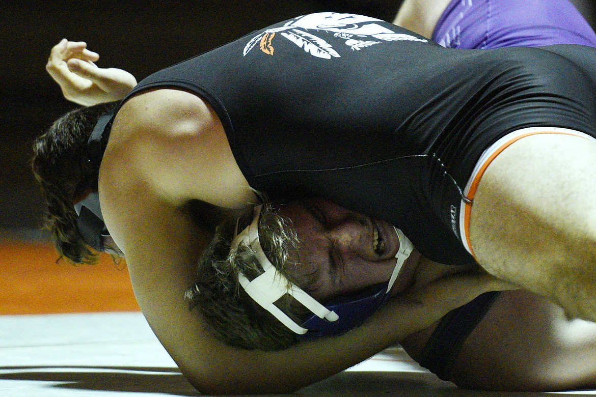 Flathead's Sebastian Koch works toward a pin of Butte's Kyle Harding at heavyweight at Flathead High School on Friday. (Casey Kreider/Daily Inter Lake)