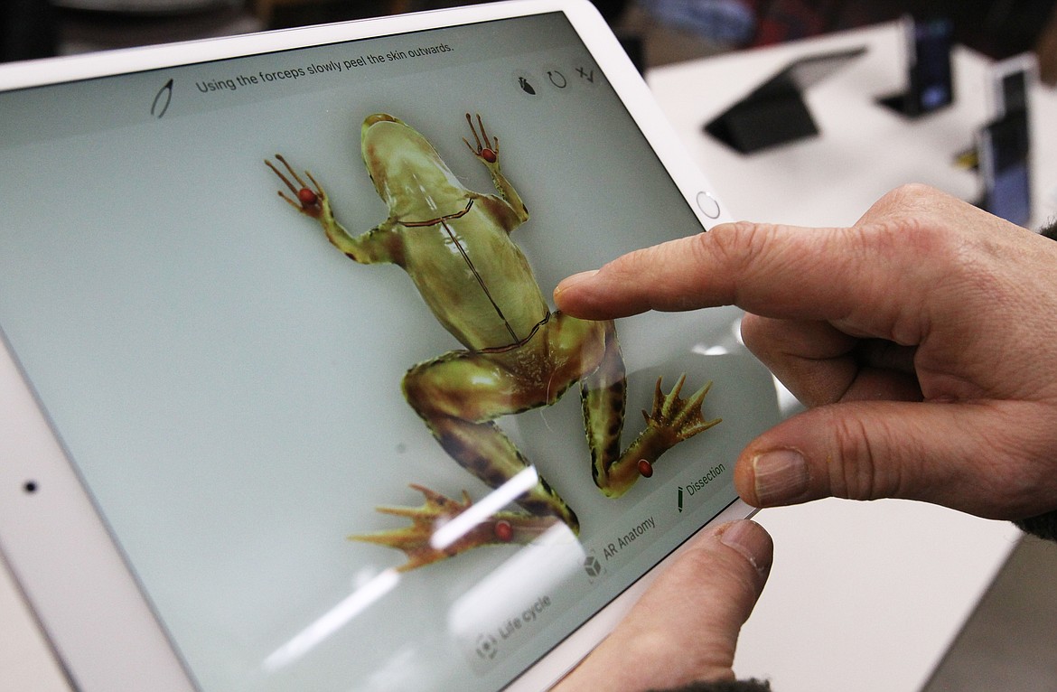 Gizmo-CDA co-founder Barb Mueller demonstrates how augmented reality applications can be used for educational purposes, such as dissecting a frog without ever having to touch one. (DEVIN WEEKS/Press)