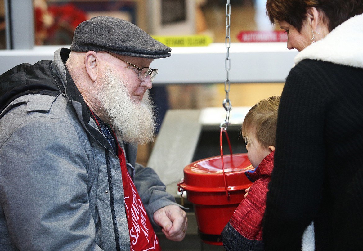 Barbie Wheeler brought her 2-year-old grandson, Bode, to see bell ringer Bill Connor at Fred Meyer on Wednesday. Wheeler is a friend of Conner's daughter, Brenda. (LOREN BENOIT/Press)