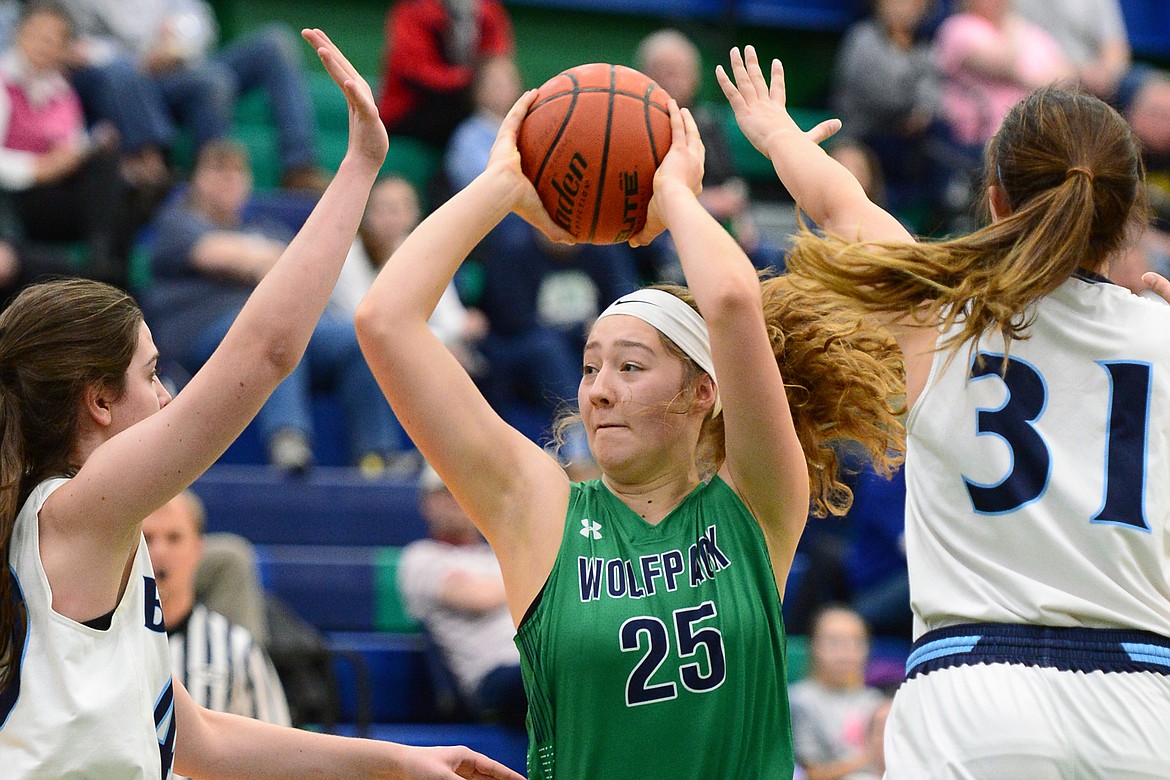 Glacier&#146;s Emma Anderson (25) looks to pass between Great Falls defenders in the first half at Glacier High School on Saturday. (Casey Kreider/Daily Inter Lake)