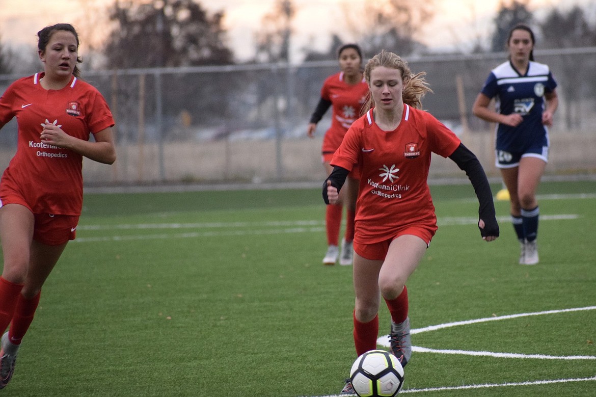 Courtesy photo
The Thorns North FC 03 Girls played the Spokane Sounders G03-A at Real Life Ministries Sports Complex in Post Falls last Sunday and won 2-1. Lily Fletcher had 1 goal, assisted by Amber Aittama, and Kali McKellips had 1 goal. Thorns pictured are Breanna Widener, left; Sophia Allan, rear, and Lily Fletcher (with ball).