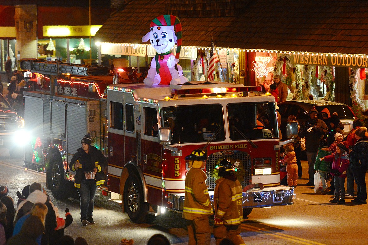 Engine 535 of the Somers/Lakeside Fire Department makes its way down Main Street during the 2018 Kalispell Christmas Parade on Saturday. (Casey Kreider/Daily Inter Lake)