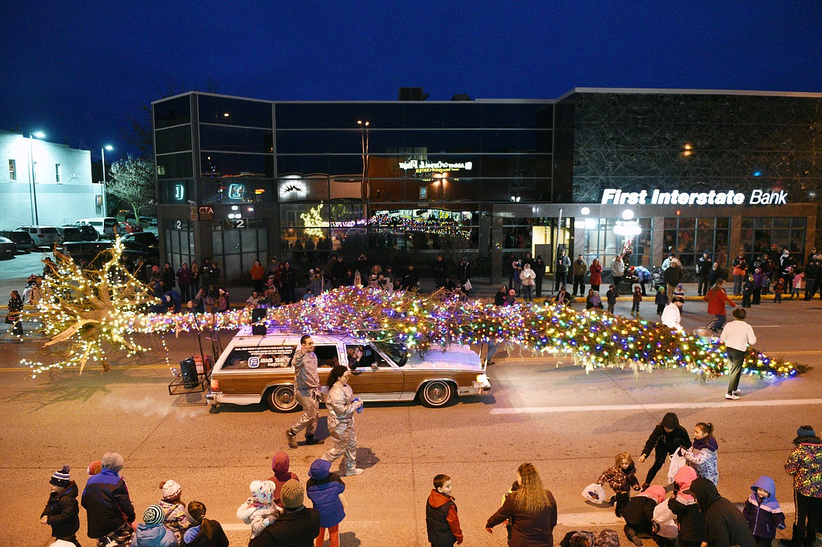 Floats make their way down Main Street during the 2018 Kalispell Christmas Parade on Saturday. (Casey Kreider/Daily Inter Lake)