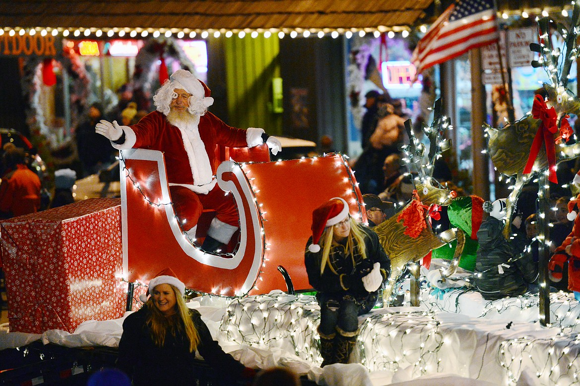 Santa Claus waves to the crowd during the 2018 Kalispell Christmas Parade on Saturday. (Casey Kreider/Daily Inter Lake)