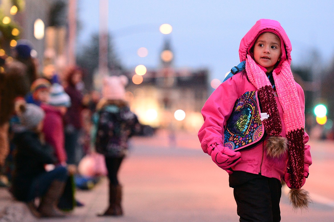 Children wait along Main Street for the start of the 2018 Kalispell Christmas Parade on Saturday. (Casey Kreider/Daily Inter Lake)