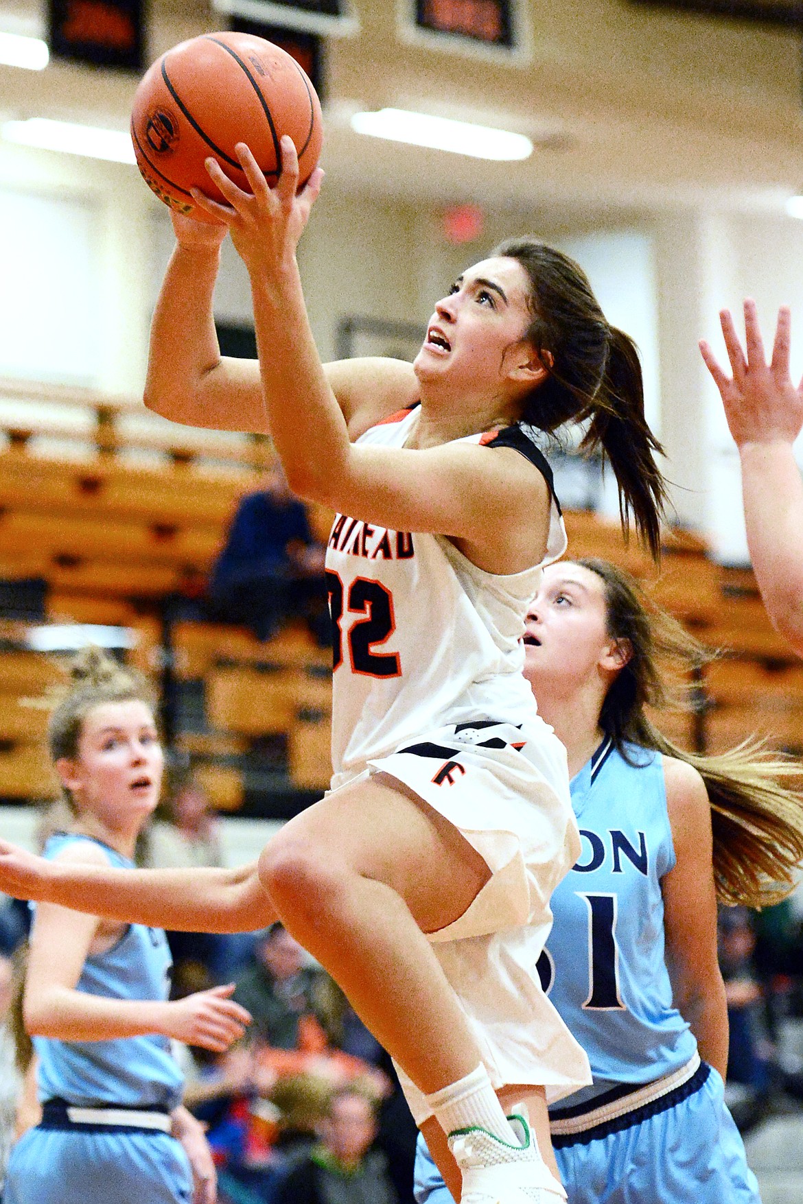 Flathead's Taylor Henley (32) drives to the hoop in the first half against Great Falls at Flathead High School on Friday. (Casey Kreider/Daily Inter Lake)